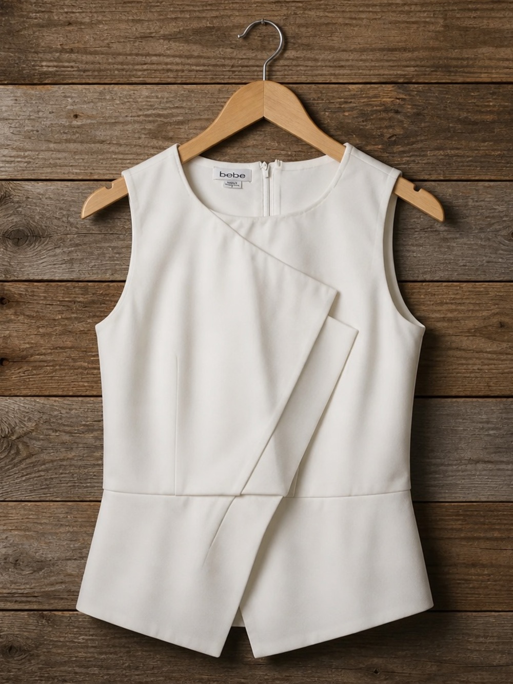 bebe Cream Asymmetrical Sleeveless Peplum Top